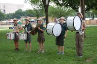 Percussion lined up and practicing their cadence