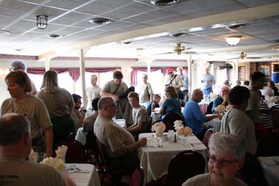 Crew Files Into River Boat For Dinner