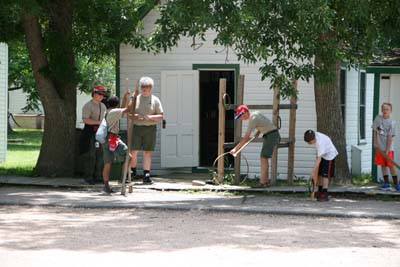 Jeb Trys Out A Hoop And Stick While Cody Tries Out The Stilts